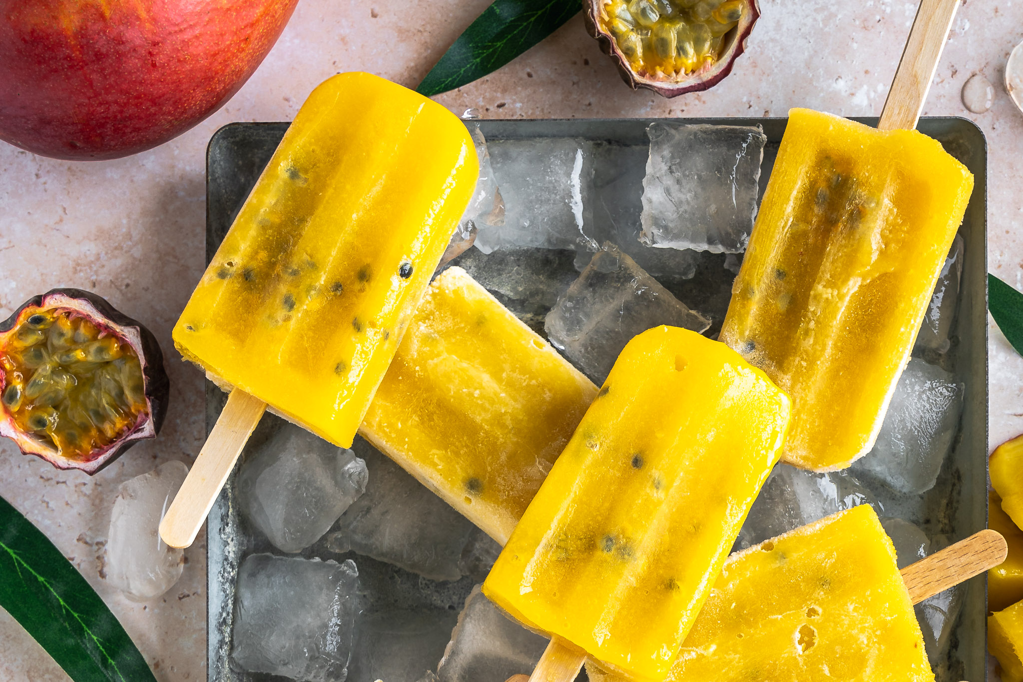 Home-made mango ginger passionfruit popsicles